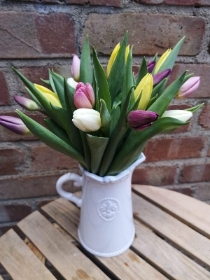 A white ceramic jug of tulips gift set with cocoa dusted salted caramel flavour truffles and FREE card